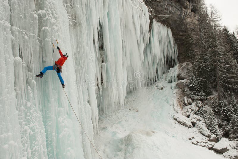 Ice climber on a frozen waterfall